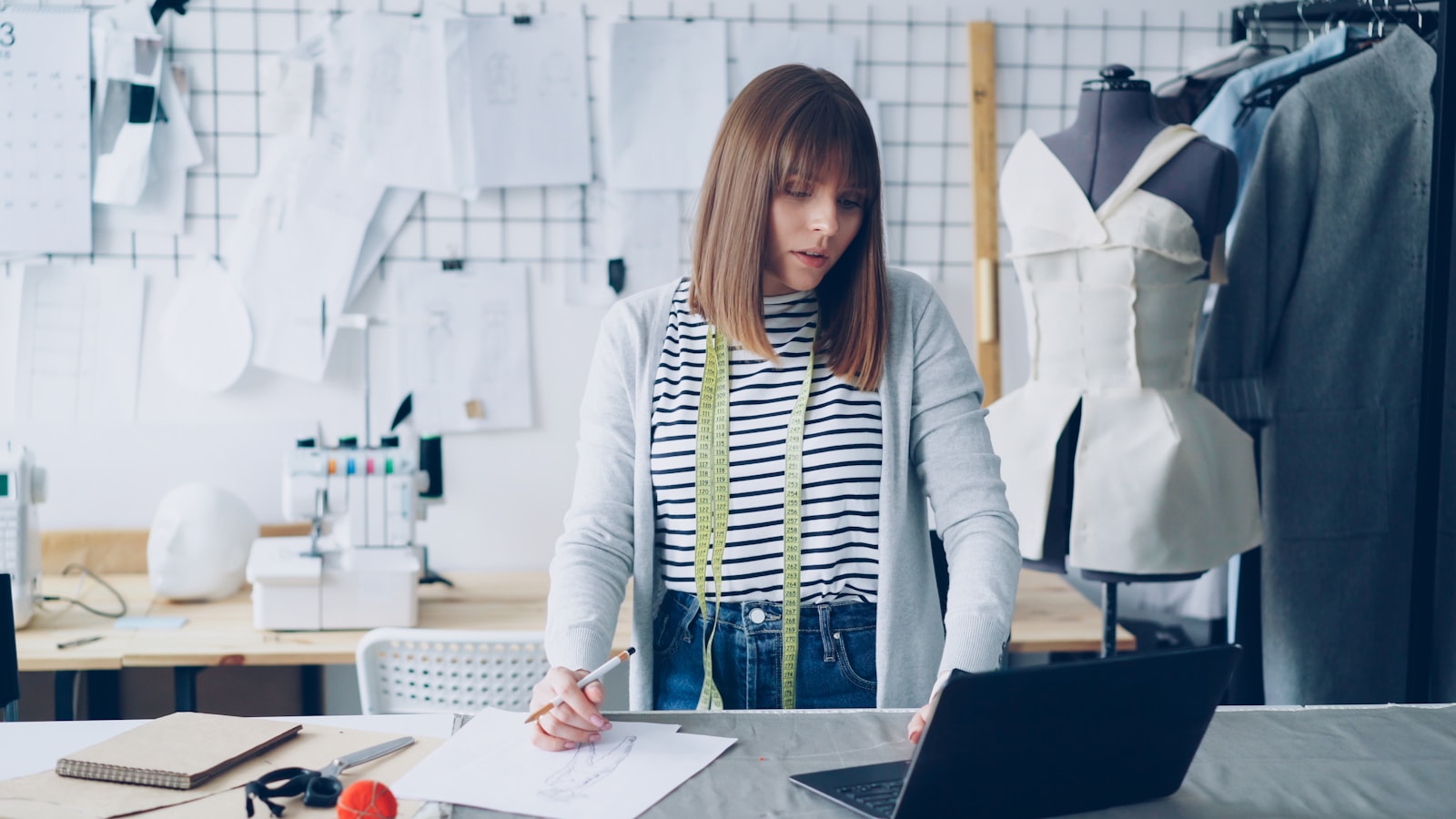 Apparel product developer preparing notes for a clothing supplier